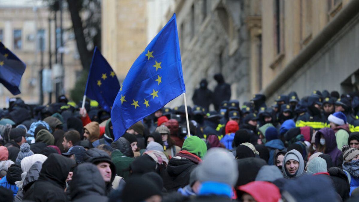 Demonstrators with EU flags rally outside the parliament to protest against the government's decision to suspend negotiations on joining the bloc in Tbilisi, Dec. 14, 2024