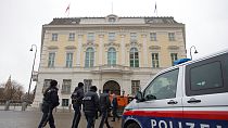 Police officers walk outside of the chancellery in Vienna, Austria, Tuesday, Jan 7, 2025.