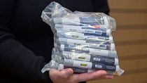 A patient holds a bag of Wegovy pens in December 2024.