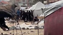 Tents for displaced people getting blown away by strong winds, displaced people tying their tent with ropes 