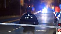 A police officer stands at a cordon during the investigation of a suspect car in the center of Brussels on Thursday, March 2, 2017.
