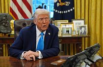 President Donald Trump speaks to reporters as he signs executive orders in the Oval Office of the White House, Tuesday, Feb. 4, 2025, in Washington.