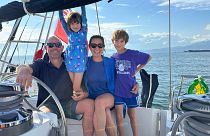 Larissa, Duncan, Skye and Eden hang out on their sailboat, Freeranger