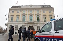 Police officers walk outside of the chancellery in Vienna, Austria, Tuesday, Jan 7, 2025.