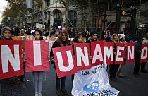FILE: Demonstrators hold placards with a phrase that reads in English "not even one less" during a march against domestic violence Buenos Aires, Argentina, June 3, 2016 