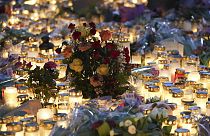 Flowers and candles near the scene of a shooting at an adult education center on the outskirts of Orebro, Sweden, Thursday, Feb. 6, 2025.