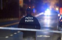 A police officer stands at a cordon during the investigation of a suspect car in the center of Brussels on Thursday, March 2, 2017.