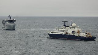 In a picture provided by the UK Ministry of Defence, a Royal Navy ship tracks Russia's Yantar vessel in the English channel