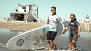 Watch: Pro-surfer paves the way for disabled students to catch waves in Argentina