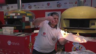Maximiliano Mieres doing pizza acrobatics with dough