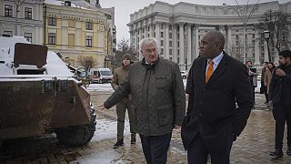 Britain's Foreign Secretary David Lammy looks at damage on a Russian APC, in central Kyiv, Ukraine, Wednesday, Feb. 5, 2025.