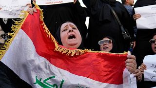 FILE - Protesters gather to demonstrate against a proposed law to permit underage female marriage in Tahrir Square in Baghdad, Iraq, 8 August, 2024. 