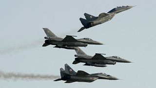 Two Russian-made Mig 2s (above) and two US-made F-16's fighter jets, all belonging to the Polish Air Force.