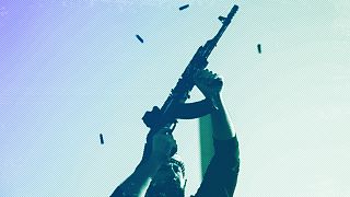 An opposition fighter fires his AK-47 in the air in celebration after opposition forces took control of the city in Damascus, 8 December 2024