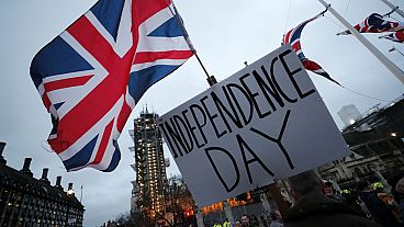 Brexit supporters gather during a rally in London, Friday, Jan. 31, 2020. Britain officially leaves the European Union on Friday after a debilitating political period.