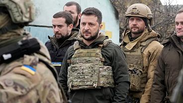 Ukrainian President Volodymyr Zelenskyy examines the site of a recent battle in Bucha, close to Kyiv, Ukraine, Monday, Apr. 4, 2022. 