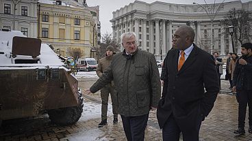 Britain's Foreign Secretary David Lammy looks at damage on a Russian APC, in central Kyiv, Ukraine, Wednesday, Feb. 5, 2025.