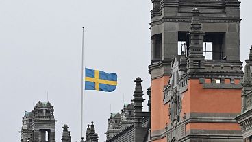 A Swedish flag flies at half-mast at Rosenbad, Sweden's Government Offices in Stockholm, Wednesday Feb. 5, 2025, after a shooting at an adult education center.