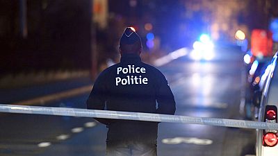 A police officer stands at a cordon during the investigation of a suspect car in the center of Brussels on Thursday, March 2, 2017.