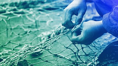 FILE: A crew member of the fishing vessel Sophie Louise II, repair's ripped net's on the dockside, in North Shields, north east England, December 2007