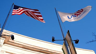 The US and USAID flags flying in Washington, DC.