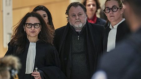 French filmmaker Christophe Ruggia arrives with his legal team at courthouse in Paris, Monday, Feb. 3, 2025