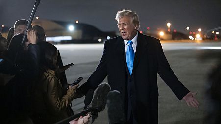 U.S. President Donald Trump speaks to reporters next to Air Force One on 2 February 2025.
