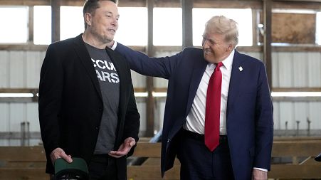 FILE - Tesla and SpaceX CEO Elon Musk, left, and Donald Trump, right, in October.