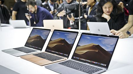 FILE - Apple shoppers