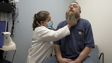 Dr Silke Niederhaus exams patient Eric Lyons at the University of Maryland in the US in May 2024.