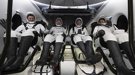 Roscosmos cosmonaut Alexander Grebenkin, left, NASA astronauts Michael Barratt, second from left, Matthew Dominick, second from right, and Jeanette Epps, right.
