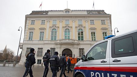 Police officers walk outside of the chancellery in Vienna, Austria, Tuesday, Jan 7, 2025.