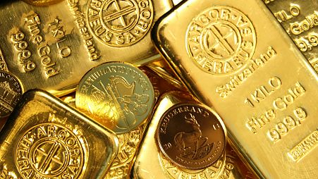 Gold bars and coins on display