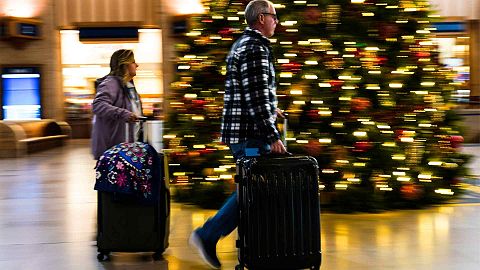 Travellers move through 30th Street Station in Philadelphia, Wednesday, Dec. 21, 2022. 