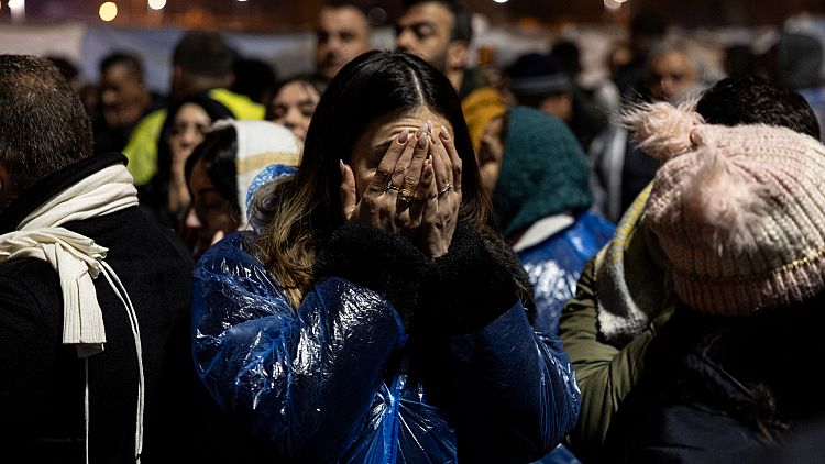 People gather to mark the two-year anniversary of the country's catastrophic earthquake