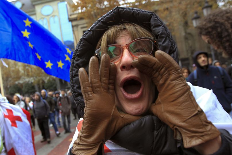 FILE: A protester shouts during a rally demanding new parliamentary elections in Tbilisi, Georgia, on Nov. 25, 2024.