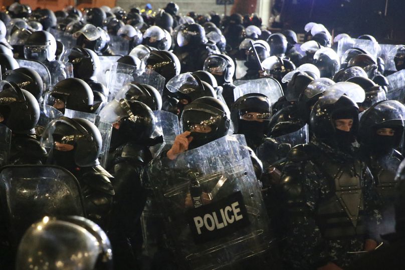 FILE: Police block demonstrators outside the parliament during a protest in Tbilisi, Georgia, 3 Dec, 2024